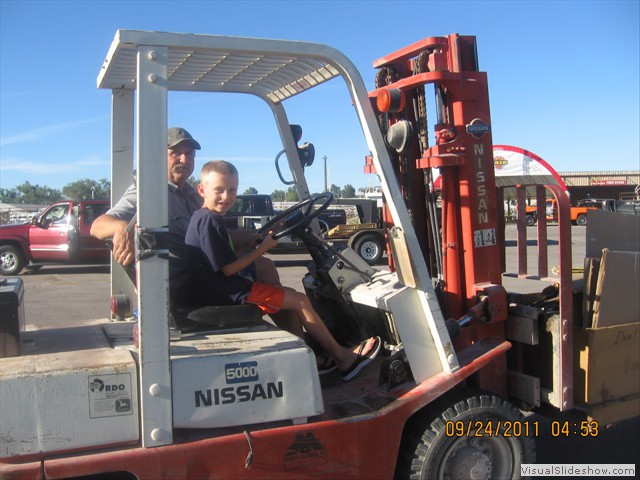 Future Forklift Operator gets his first lesson.