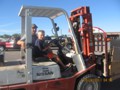 Future Forklift Operator gets his first lesson.